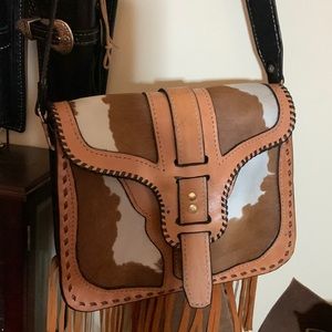 Genuine leather purse with an amazing detailing around .